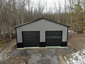 Black and grey pole barn garage by Stately Post Frame in Clarence, NY.