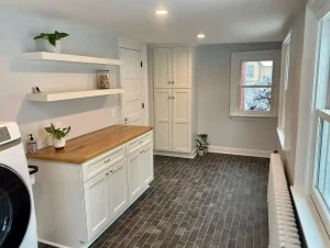 Laundry room remodel in a historic Buffalo home by Stately Kitchen and Bath.
