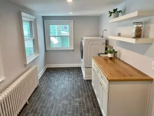 Laundry room remodel in a historic Buffalo home by Stately Kitchen and Bath.