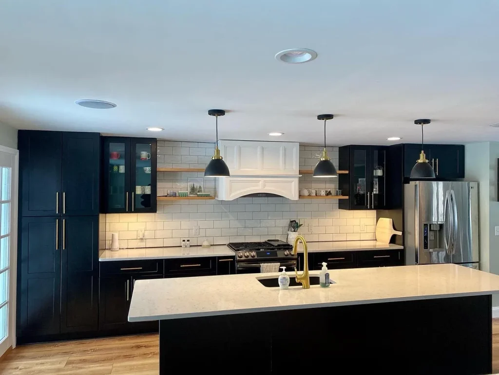 Kitchen overview. Trendy black and white kitchen by Stately Kitchen and Bath in Clarence Center, NY.