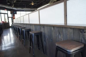 Custom carpentry for The Ridge brewery in West Seneca, NY by Stately Builders.