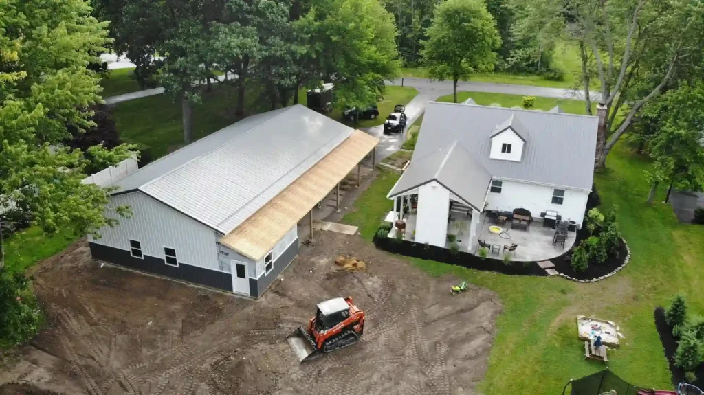 Large pole barn garage with lean-to under construction by Stately Post Frame in Clarence Center, NY.