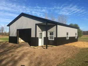 Pole barn garage with small lean-to by Stately Post Frame in Akron, NY.