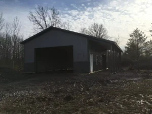 Sleek grey pole barn garage by Stately Post Frame in Grand Island, NY.