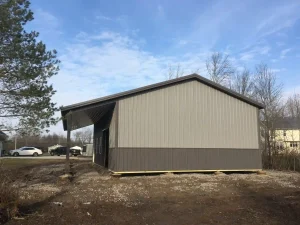 Sleek grey pole barn garage by Stately Post Frame in Grand Island, NY.