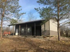 Sleek grey pole barn garage by Stately Post Frame in Grand Island, NY.