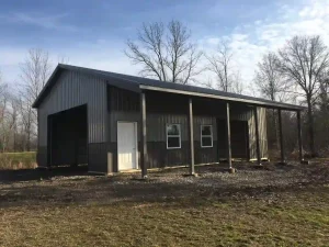 Sleek grey pole barn garage by Stately Post Frame in Grand Island, NY.