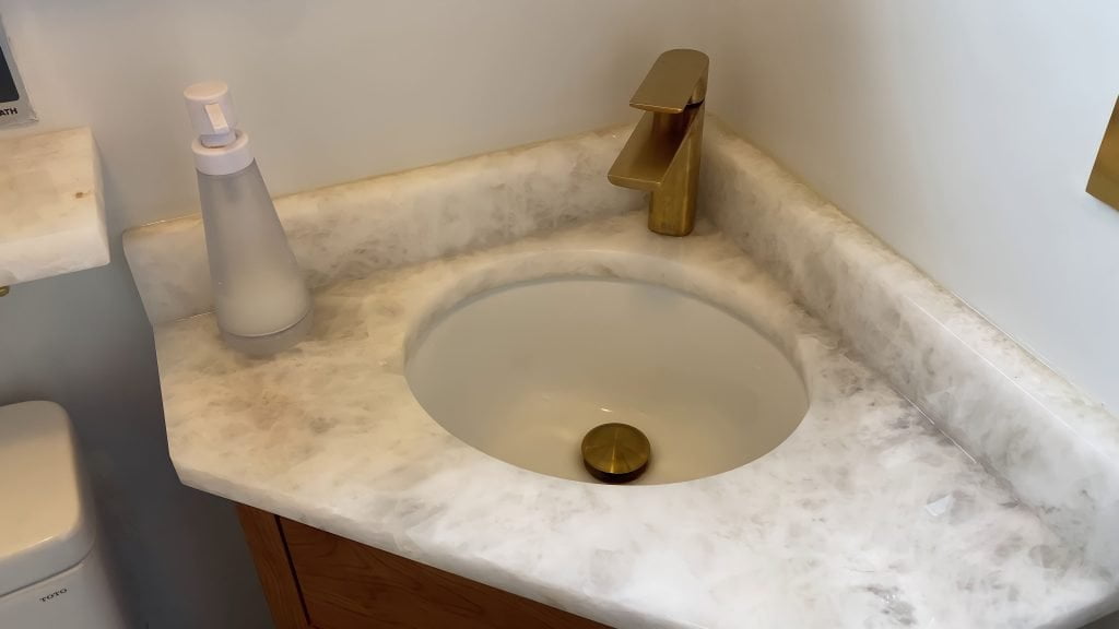 Custom vanity by Reusch Woordworking, installed by Stately Kitchen and Bath in Kenmore, NY.