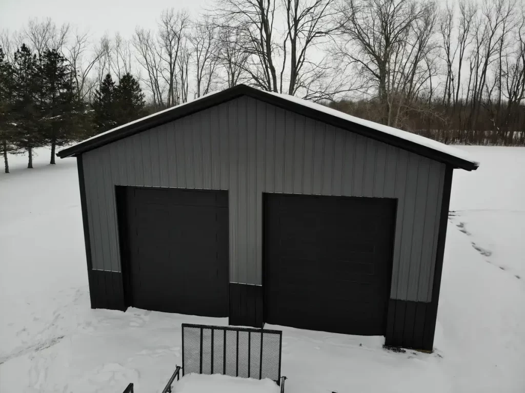 Elevated view of a Stately Pole Barn in East Amherst, NY, with a snowy roof, exemplifying sturdy winter resilience.