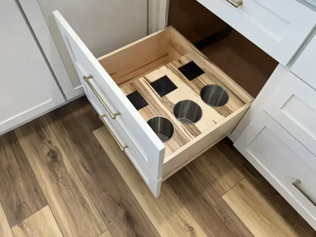 Clarence, NY kitchen renovation featuring custom drawer with built-in storage for large utensils and knives, part of Stately Kitchen & Bath’s bespoke cabinetry solutions.