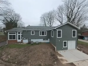 Stately General Contracting completed home addition in Clarence, NY, featuring an expanded primary bedroom suite and basement storage.