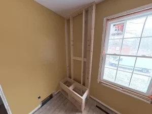 Framed shower bench in bathroom addition by Stately General Contracting in Clarence, NY, highlighting construction progress.