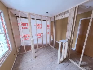 Bathroom framing during home addition project by Stately General Contracting in Clarence, NY, showcasing new layout.