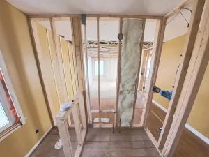 Primary bathroom framing and insulation installation in Clarence, NY home addition.
