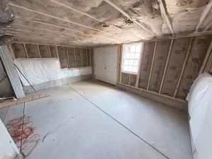Framed and insulated basement extension for additional storage space in Clarence, NY home.