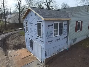 Construction of new primary bedroom suite and basement extension in Clarence, NY with Typar house wrap.