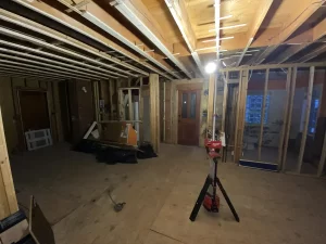 Kitchen remodel in Amherst, NY - construction stage with a wide view of the kitchen area being framed.