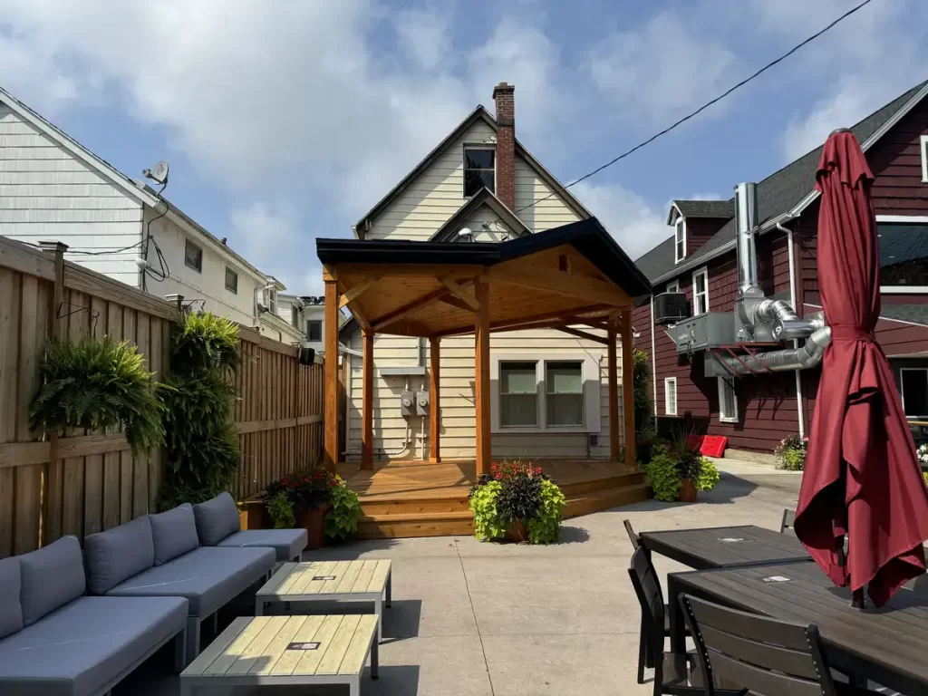 Wooden soundstage in Buffalo Olde Brewing beer garden, featuring elevated platform and sturdy wooden beams