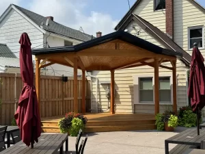 Close-up of the newly constructed wooden soundstage at Buffalo Olde Brewing, highlighting craftsmanship and attention to detail.