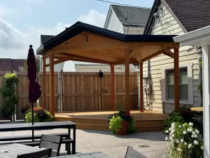 Buffalo Olde Brewing beer garden with a new wooden soundstage, perfect for live performances and outdoor gatherings.