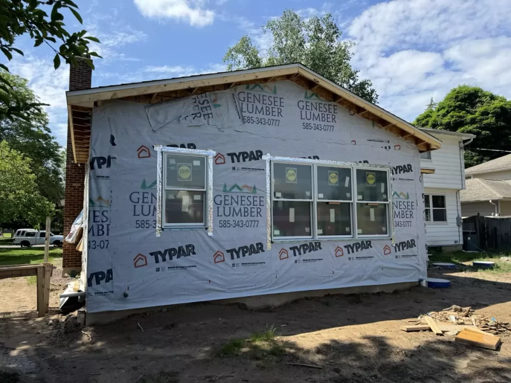 Side view of framed exterior for a home addition in Amherst, NY, wrapped with Genesee Lumber materials, awaiting final siding.