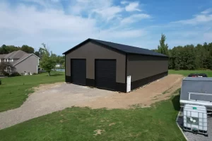 Side angle of brown & black pole barn in Holland, NY