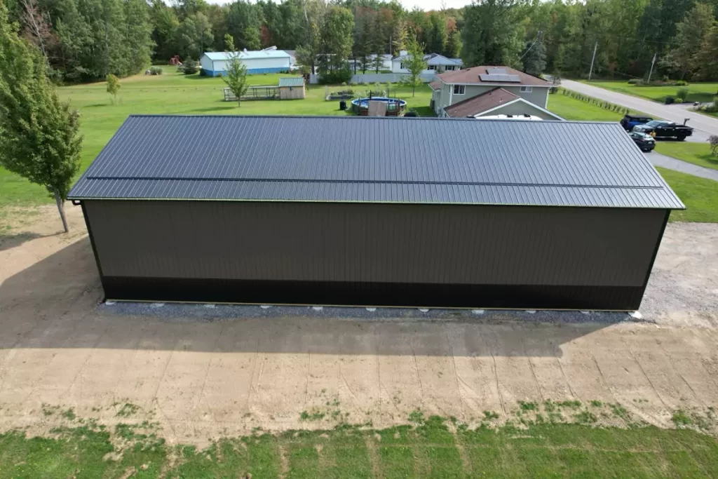 Side angle of Stately’s post-frame barn, emphasizing the structure’s 80-foot length and Everlast II™ steel panels.