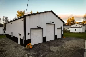 Side view of a Stately Pole Barns with vinyl windows, built for ventilation and durability in Holland, NY.