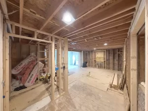 Partially framed walls and construction materials in the middle of remodeling phase.