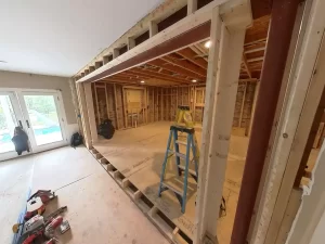 Open concept layout taking shape with new steel header and framing.