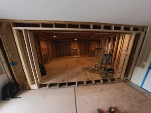 Open concept layout taking shape with new steel header and framing.