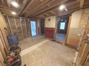 Kitchen demolition with exposed framing during onset of renovation.