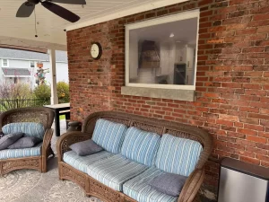Expanded window by Stately Kitchen and Bath remodel, with precise masonry work blending the new addition into the original brick facade.