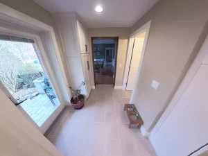 Back porch entry with tile flooring and custom storage cabinets by Stately Kitchen and Bath in Clarence, NY.