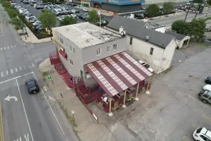 Progress on Ballyhoo Buffalo’s new covered deck, Stately Pole Barns framing structure with wooden beams.