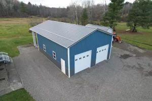 Corner shot of blue pole barn remodel in Colden, NY