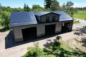 Aerial view of custom 60x40 pole barn featuring Everlast II™ steel siding and a center reverse gable.