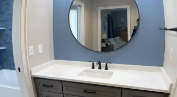 Vanity 1 of 2 in a shared bathroom remodeled by Stately Kitchen and Bath in Orchard park, NY.