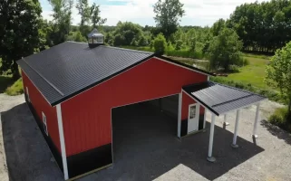 Red pole barn by Stately Post Frame in Clarence Center, NY.