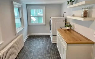 Laundry room remodel in a historic Buffalo home by Stately Kitchen and Bath.