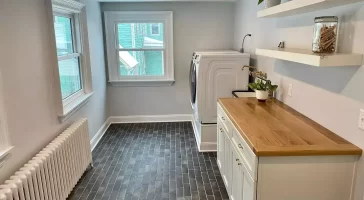 Laundry room remodel in a historic Buffalo home by Stately Kitchen and Bath.