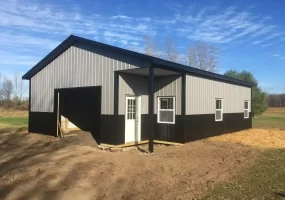 Pole barn garage with small lean-to by Stately Post Frame in Akron, NY.