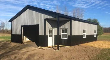 Pole barn garage with small lean-to by Stately Post Frame in Akron, NY.