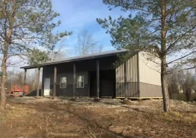Sleek grey pole barn garage by Stately Post Frame in Grand Island, NY.