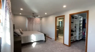 Master bedroom, ensuite bathroom, and walk-in closet addition by Stately General Contracting in Williamsville, NY.