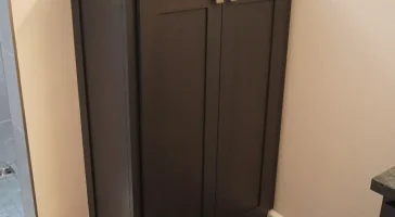Custom linen cupboard. Master bathroom remodel in Clarence, NY by Stately Kitchen and Bath.