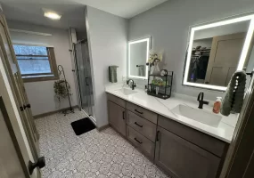 Second-story addition in West Seneca, NY by Stately General Construction. Remodeled master bathroom.